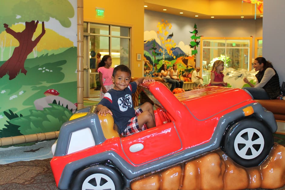 boy in red car at derda rec center