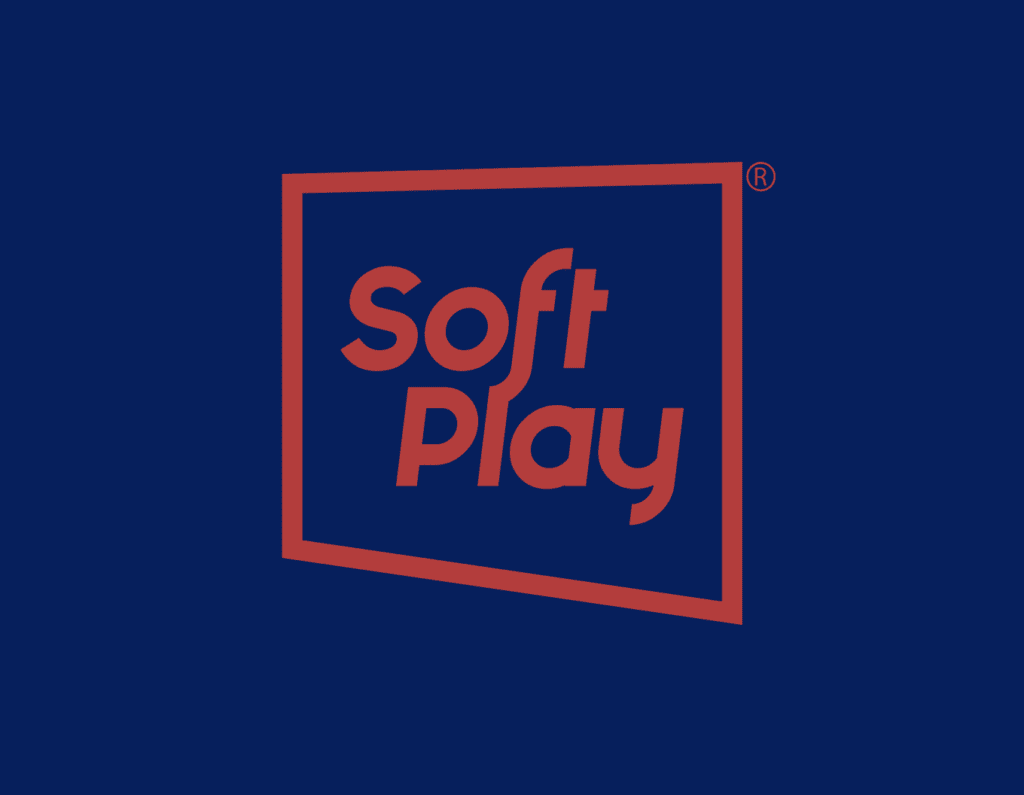 The image features the phrase "Soft Play" written in bold red letters with a distinctive font, enclosed within a red square frame with broken lines resembling an atom's orbit against a dark blue background. A registered trademark symbol is located at the top right corner.