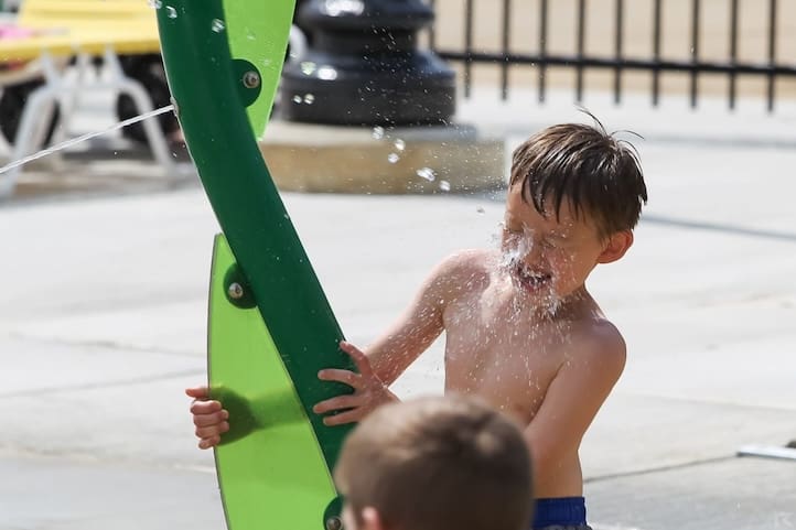 kids playing with water sprayers