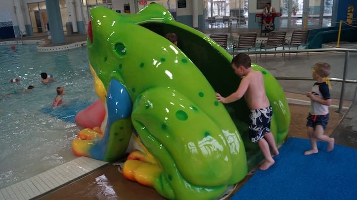 kids playing on water slide in rec center