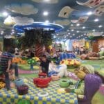 families enjoying story book themed kid area