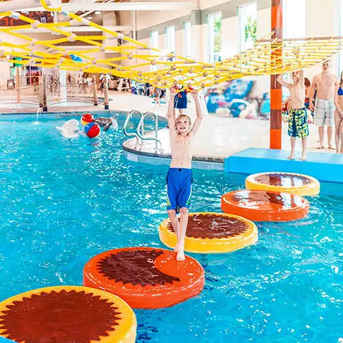 boy playing on specialty branded water walk