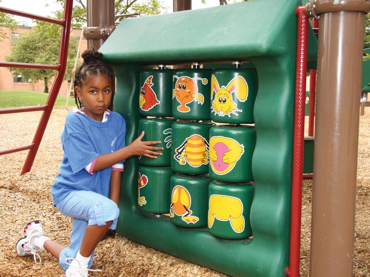 girl at play playing with matching game play panel