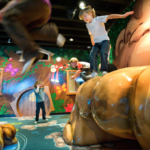 children climbing and jumping on soft sculpture playground