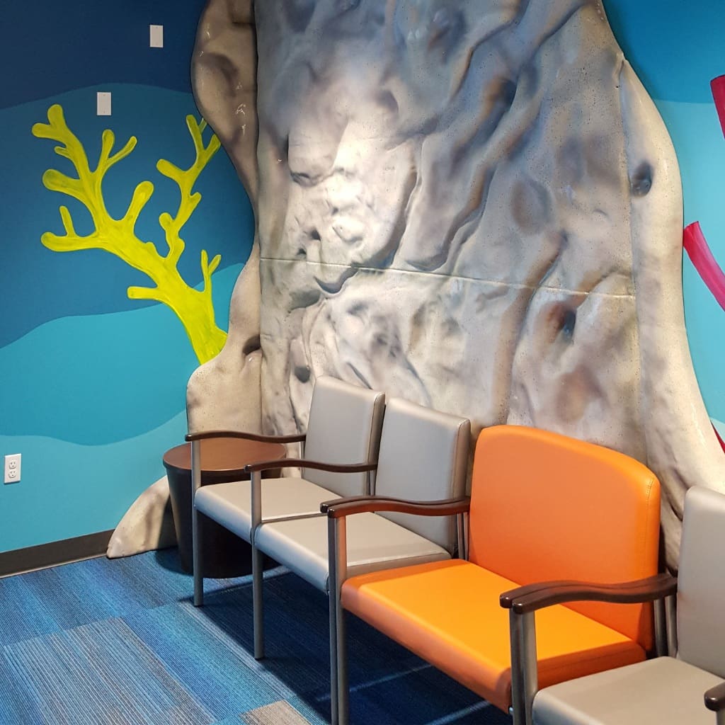 seating at doctor's office, wall decor that resembles hard coral