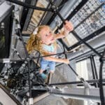 girl climbing on skycourse equipment