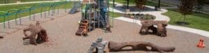 outdoor playground with woodland sculptures