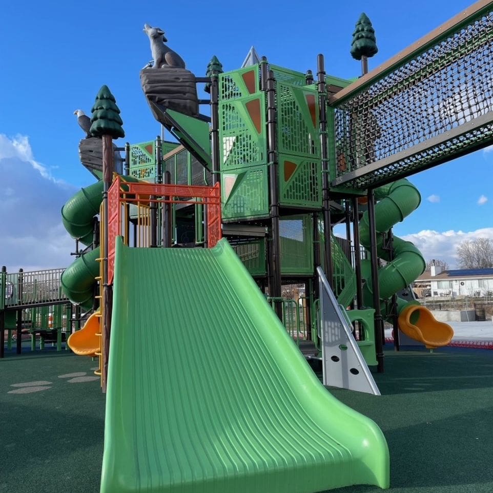 outdoor playground with sculpted wildlife elements